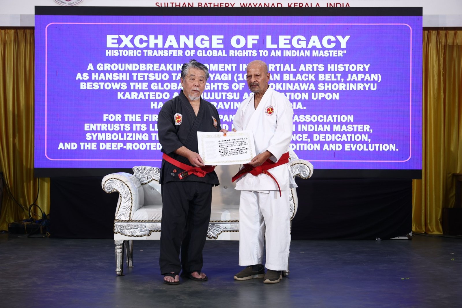hanshi tetsuo takamiyagi formally bestowing the leadership rights of the association to hanshi ravindran k.p, honoring him as the first indian to achieve this esteemed role (large)