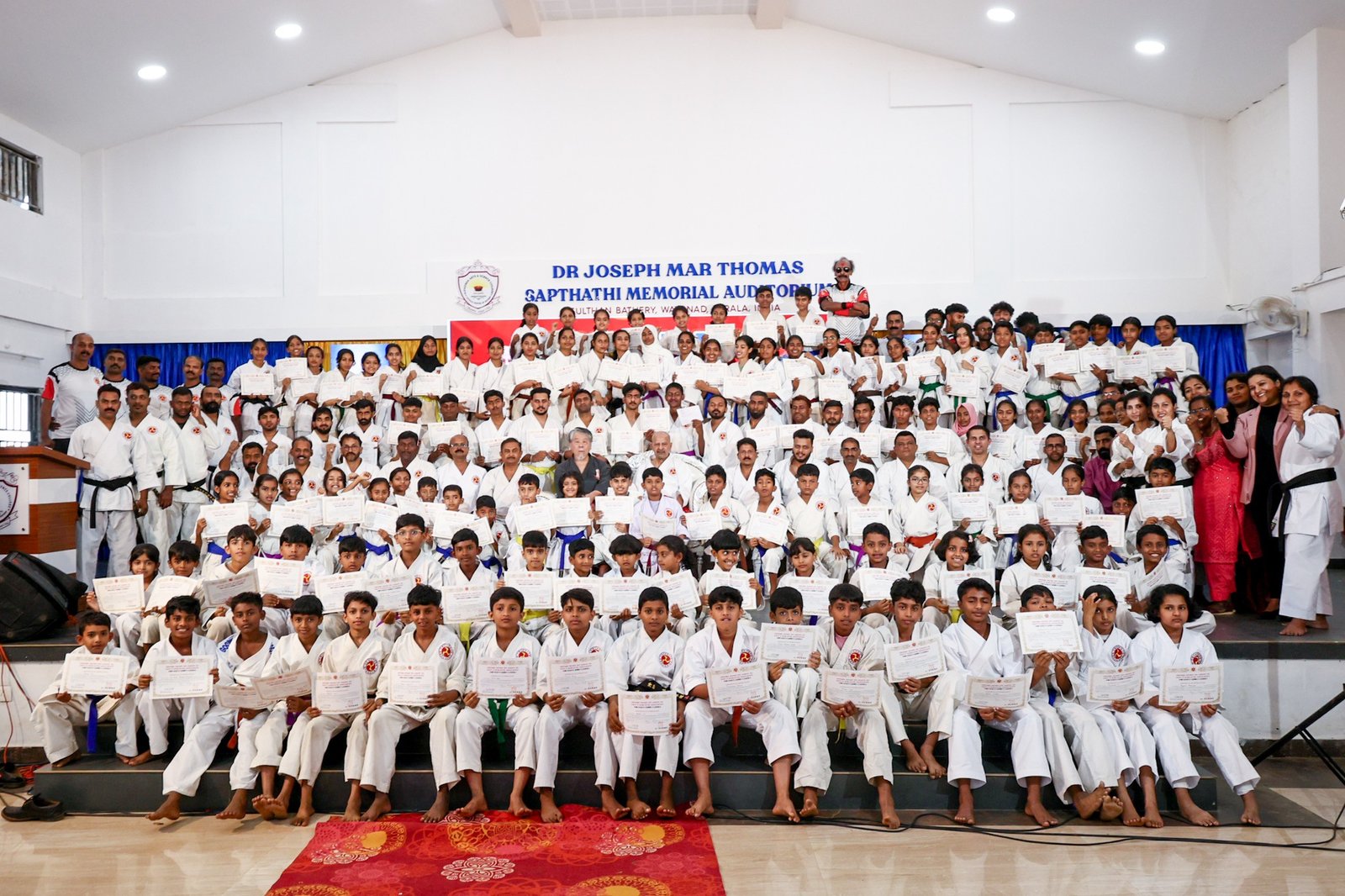 a group of dedicated karate students from the okinawa shorin ryu karate do udunti kobujutsu association training together.